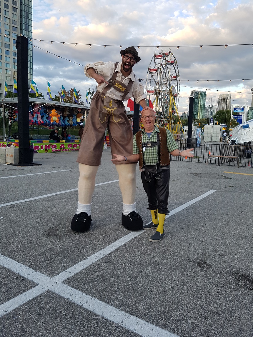 George Kash with giant Lederhosen man at Toronto Oktoberfest
